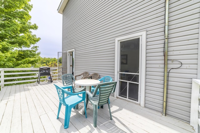 15657 Lakeview Dr, Buchanan, MI 49107 - wooden deck with a grill and outdoor dining space