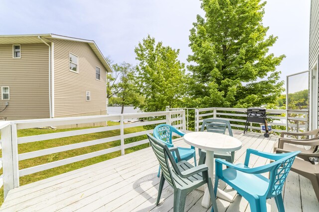 15657 Lakeview Dr, Buchanan, MI 49107 - wooden terrace with outdoor dining area and grilling area