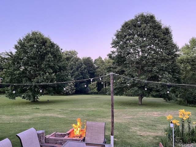 7033 N M-140, Watervliet, MI 49098 - view of grassy yard with a fire pit