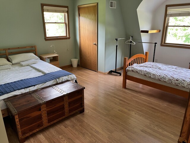 7033 N M-140, Watervliet, MI 49098 - bedroom featuring light wood-style flooring and baseboards