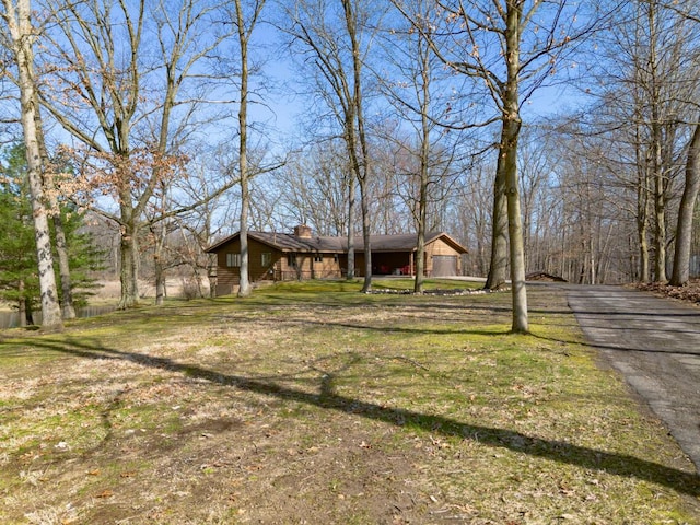 10989 E D E Ave, Richland, MI 49083 - view of front of property with a chimney, driveway, and a front yard