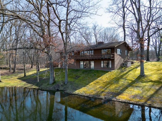 10989 E D E Ave, Richland, MI 49083 - rear view of property featuring a yard, a chimney, and a deck with water view
