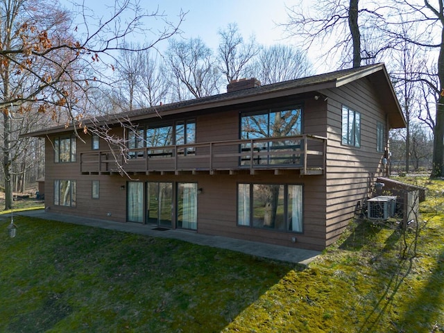 10989 E D E Ave, Richland, MI 49083 - rear view of property with central AC, a chimney, a yard, and a patio area