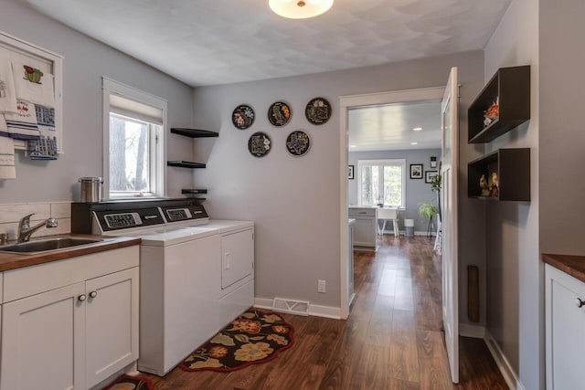 10989 E D E Ave, Richland, MI 49083 - laundry room featuring washer and dryer, dark wood finished floors, cabinet space, and baseboards