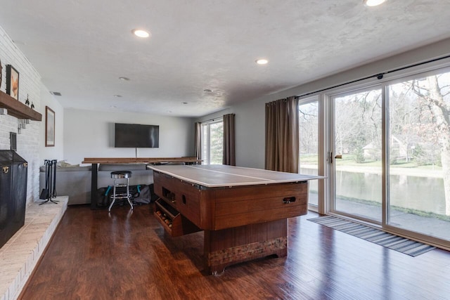 10989 E D E Ave, Richland, MI 49083 - game room with dark wood finished floors, recessed lighting, and a wood stove