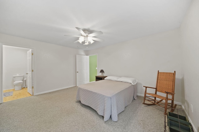 12021 Pope Church Rd, Springport, MI 49284 - carpeted bedroom featuring baseboards, ensuite bath, and a ceiling fan