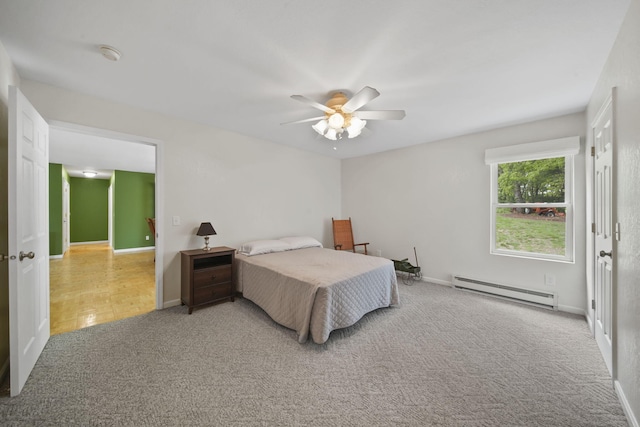 12021 Pope Church Rd, Springport, MI 49284 - bedroom featuring a baseboard heating unit, carpet flooring, baseboards, and a ceiling fan
