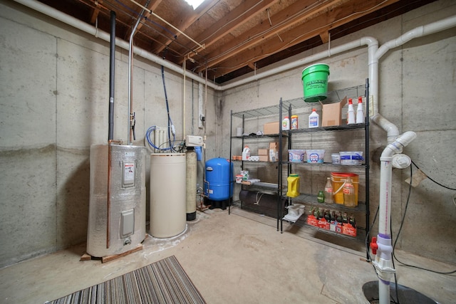 12021 Pope Church Rd, Springport, MI 49284 - unfinished basement featuring a water pressure tank, a water softener system, and water heater