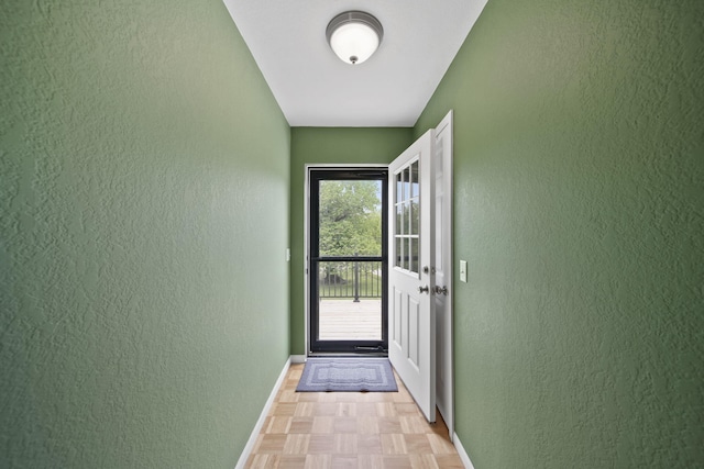 12021 Pope Church Rd, Springport, MI 49284 - doorway to outside featuring a textured wall and baseboards