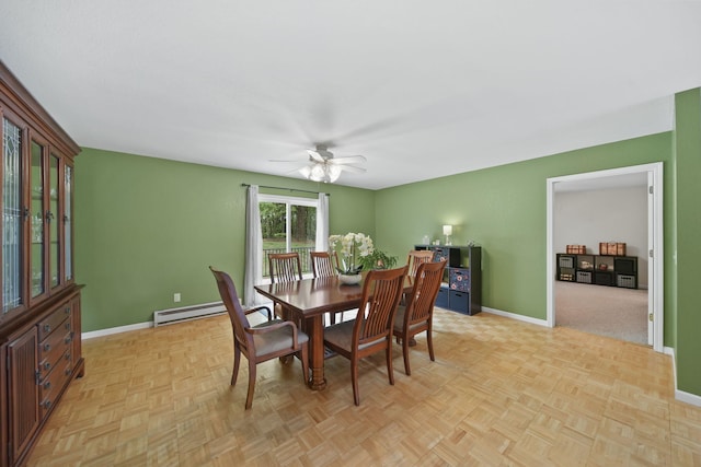 12021 Pope Church Rd, Springport, MI 49284 - dining room featuring baseboards, a ceiling fan, and a baseboard radiator