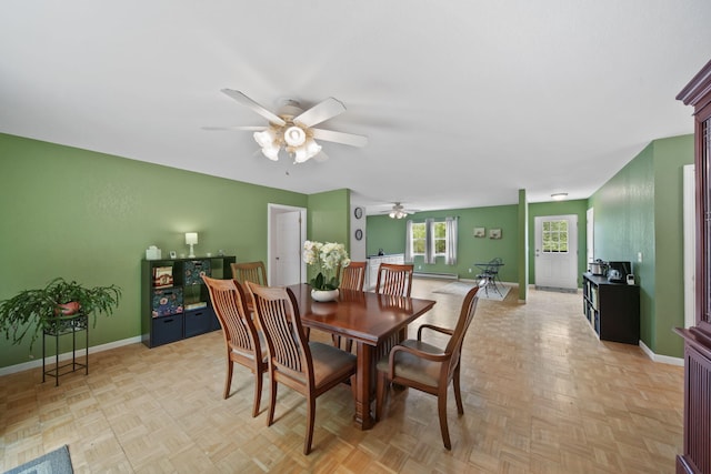 12021 Pope Church Rd, Springport, MI 49284 - dining area featuring a ceiling fan, baseboards, and baseboard heating