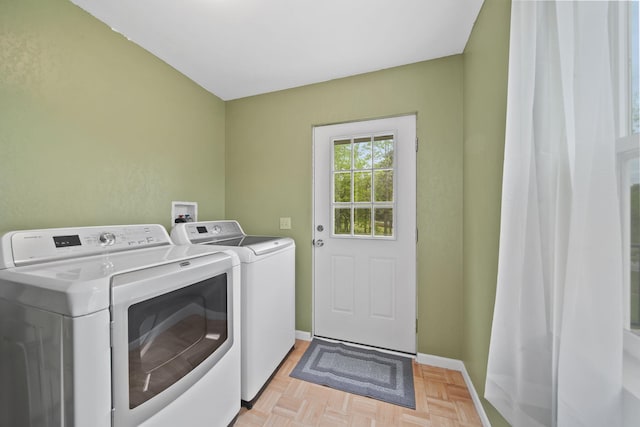 12021 Pope Church Rd, Springport, MI 49284 - laundry room with washing machine and clothes dryer and baseboards