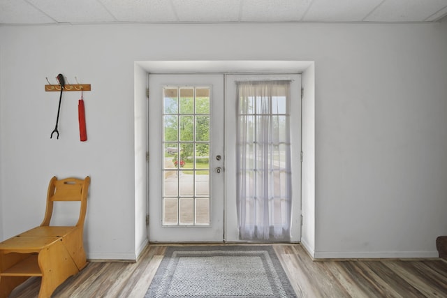 12021 Pope Church Rd, Springport, MI 49284 - doorway featuring wood finished floors, baseboards, and a drop ceiling