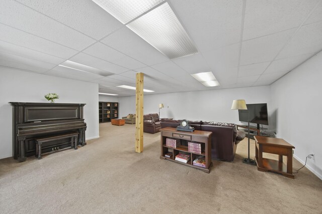 12021 Pope Church Rd, Springport, MI 49284 - living area featuring carpet flooring, a paneled ceiling, and baseboards