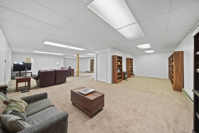 12021 Pope Church Rd, Springport, MI 49284 - living room featuring carpet floors, a drop ceiling, and baseboards