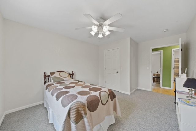12021 Pope Church Rd, Springport, MI 49284 - carpeted bedroom with baseboards and ceiling fan