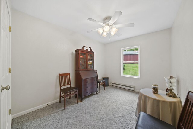 12021 Pope Church Rd, Springport, MI 49284 - sitting room with baseboard heating, ceiling fan, carpet flooring, and baseboards