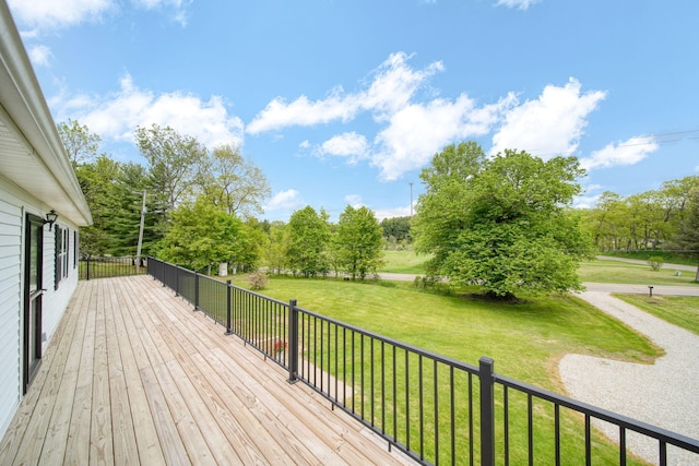 12021 Pope Church Rd, Springport, MI 49284 - wooden terrace with a lawn and view of wooded area