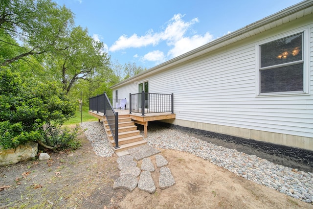 12021 Pope Church Rd, Springport, MI 49284 - view of side of home featuring stairs and a wooden deck