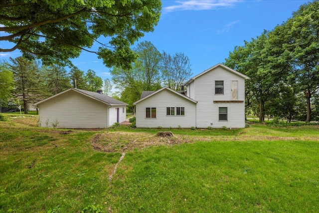 236 Simpson St, Grass Lake, MI 49240 - rear view of house with a lawn