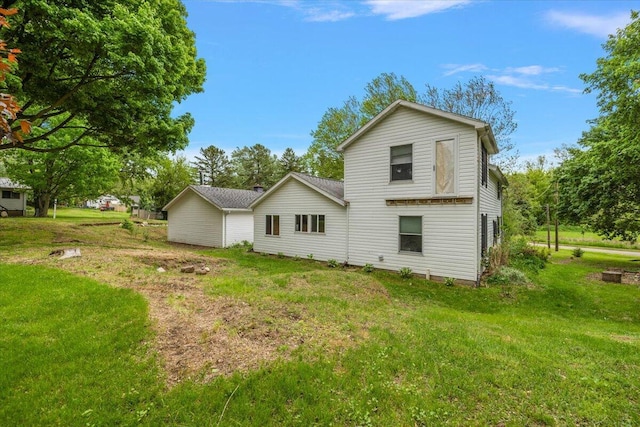 236 Simpson St, Grass Lake, MI 49240 - rear view of property with a lawn