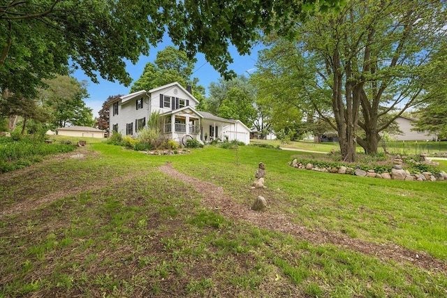236 Simpson St, Grass Lake, MI 49240 - view of front of property with a front yard and an attached garage
