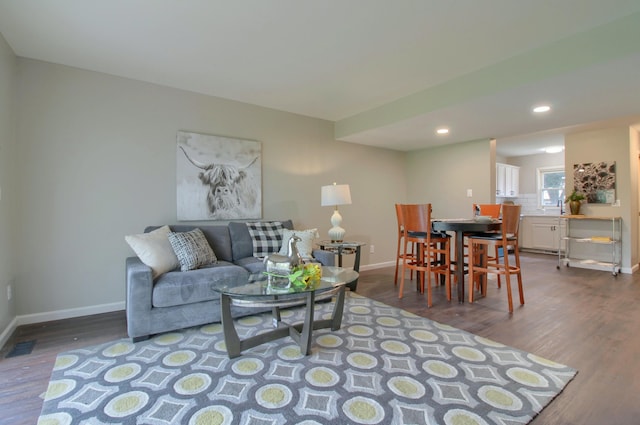 2611 Kingstowne Dr, Michigan, MI 48390 - living room featuring baseboards, dark wood-style floors, and recessed lighting