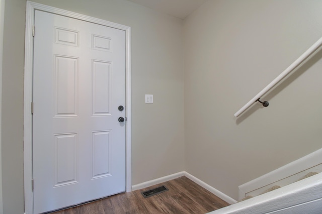 2611 Kingstowne Dr, Michigan, MI 48390 - doorway featuring dark wood-style flooring and baseboards