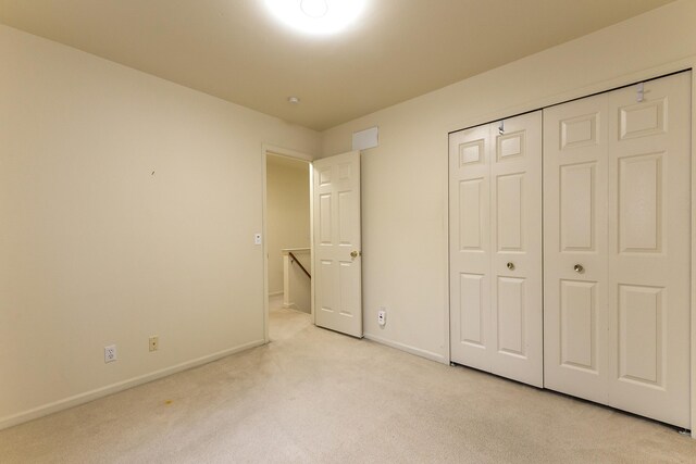3048 Turnberry Ln, Ann Arbor, MI 48108 - unfurnished bedroom with light carpet, baseboards, and a closet