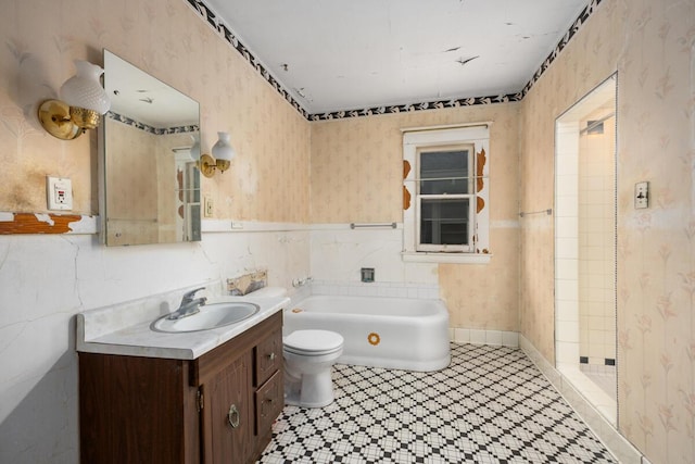 554 Ethel Ave SE, Grand Rapids, MI 49506 - bathroom featuring wallpapered walls, vanity, toilet, a bath, and tile patterned floors