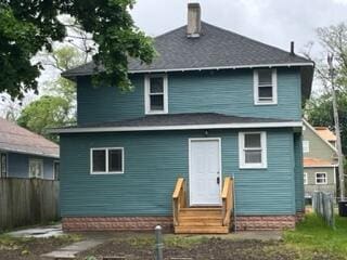 872 Mcalister Ave, Benton Harbor, MI 49022 - rear view of property featuring entry steps and a chimney
