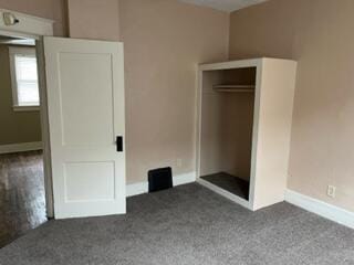 872 Mcalister Ave, Benton Harbor, MI 49022 - unfurnished bedroom featuring carpet floors, baseboards, and a closet