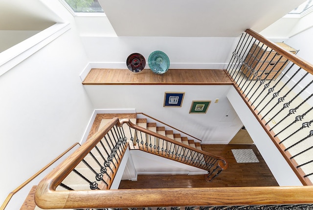 810 Cottageview Dr, Traverse City, MI 49684 - staircase with wood finished floors and baseboards