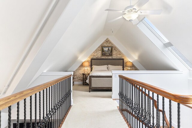 810 Cottageview Dr, Traverse City, MI 49684 - bedroom with carpet floors, vaulted ceiling, and a ceiling fan