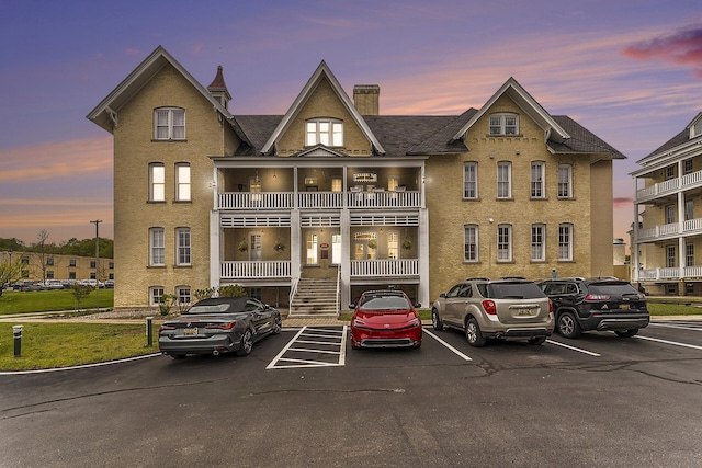 810 Cottageview Dr, Traverse City, MI 49684 - view of building exterior featuring uncovered parking