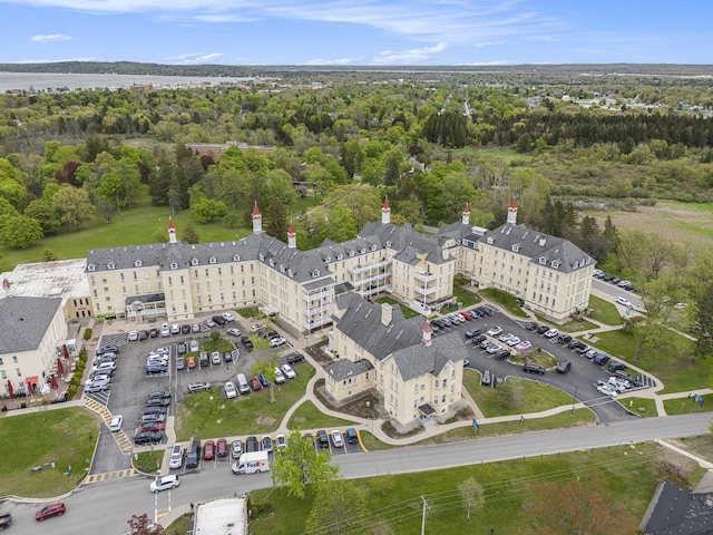 810 Cottageview Dr, Traverse City, MI 49684 - drone / aerial view of a heavily wooded area and apartment complex / building