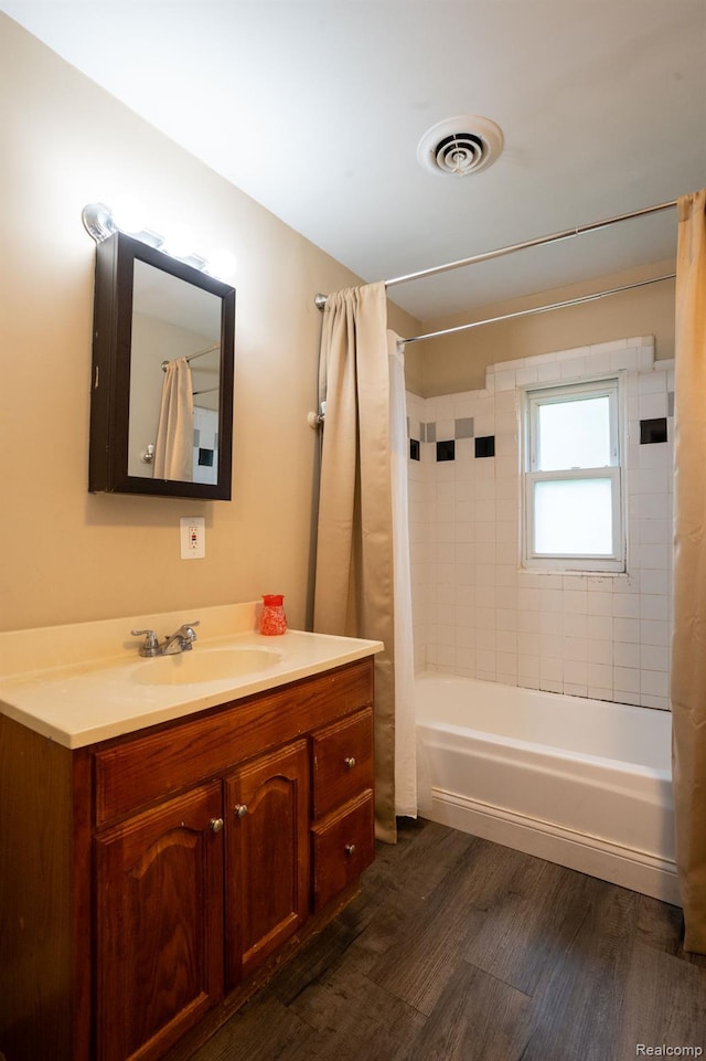 26640 Pattow St, Roseville, MI 48066 - full bath featuring shower / bath combination with curtain, vanity, and wood finished floors