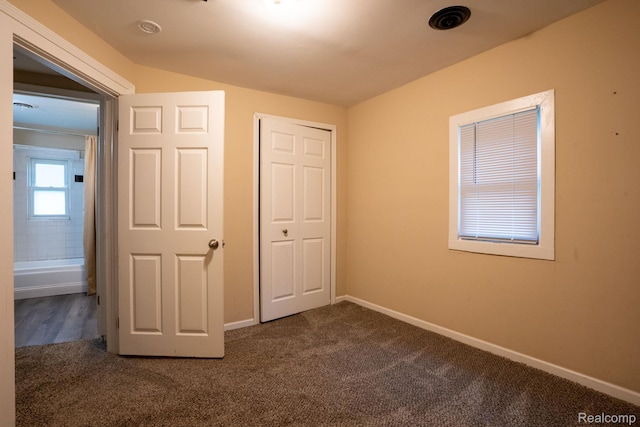 26640 Pattow St, Roseville, MI 48066 - unfurnished bedroom with dark carpet, baseboards, and a closet