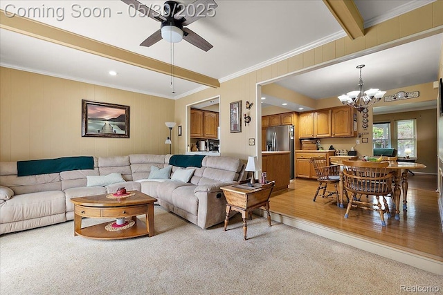 7188 Vicksburg Cir, Shelby Twp, MI 48317 - living room featuring beamed ceiling, a chandelier, crown molding, ceiling fan, and light wood-type flooring