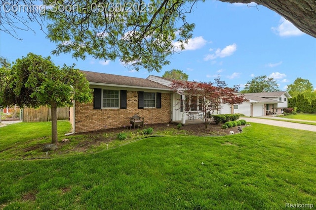 7188 Vicksburg Cir, Shelby Twp, MI 48317 - ranch-style home with concrete driveway, an attached garage, and brick siding