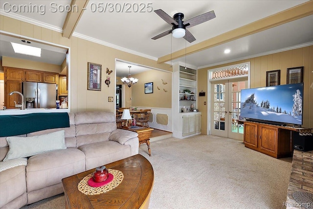 7188 Vicksburg Cir, Shelby Twp, MI 48317 - living room featuring crown molding, a decorative wall, ceiling fan, a chandelier, and light colored carpet
