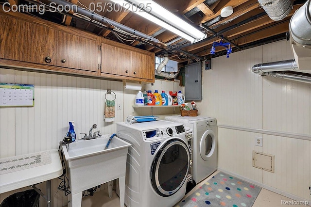7188 Vicksburg Cir, Shelby Twp, MI 48317 - washroom featuring cabinet space, electric panel, and washing machine and clothes dryer