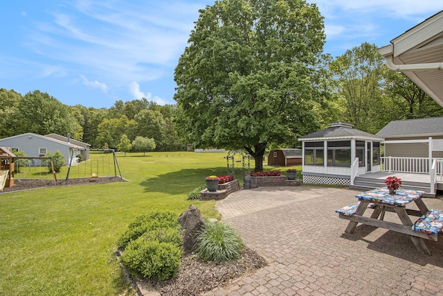 9490 N 12th St, Kalamazoo, MI 49009 - view of green lawn featuring a gazebo, a patio area, and a wooden deck