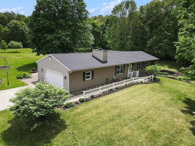 9490 N 12th St, Kalamazoo, MI 49009 - single story home with covered porch, a chimney, a front lawn, a garage, and a shingled roof