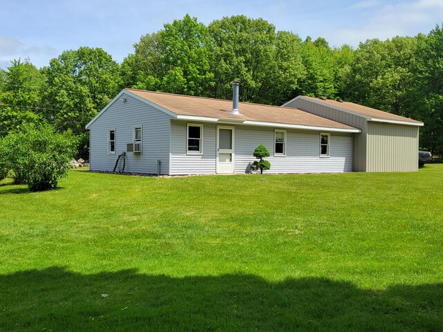 9490 N 12th St, Kalamazoo, MI 49009 - view of front of house with a front yard and cooling unit