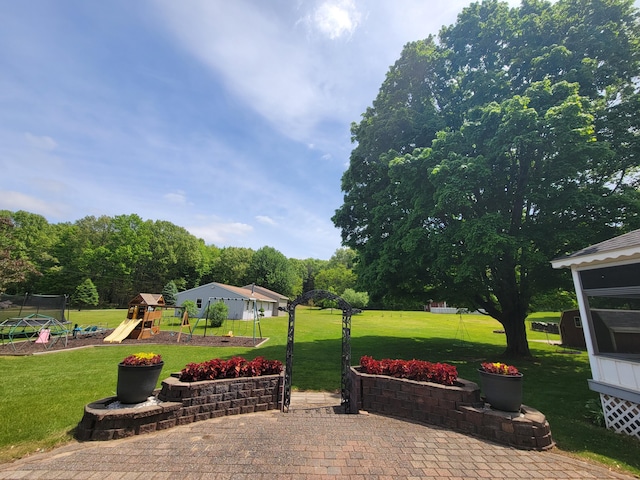 9490 N 12th St, Kalamazoo, MI 49009 - view of patio / terrace featuring a playground