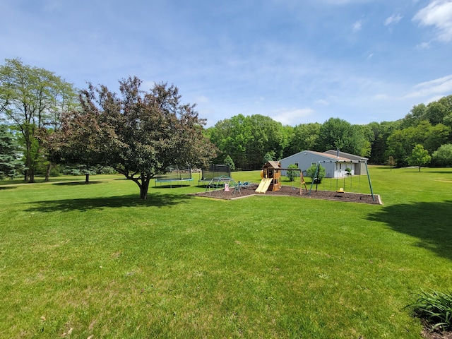9490 N 12th St, Kalamazoo, MI 49009 - view of green lawn with a trampoline