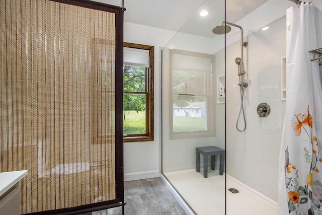 9490 N 12th St, Kalamazoo, MI 49009 - full bathroom with a shower with curtain, wood finished floors, vanity, and baseboards