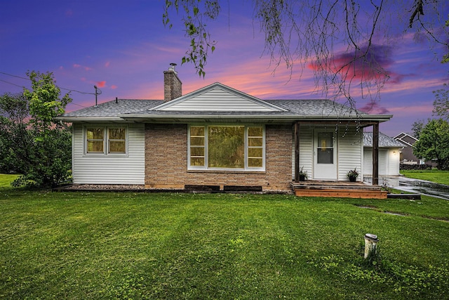7432 Burlingame Ave SW, Byron Center, MI 49315 - view of front of property with a front yard, a chimney, and a shingled roof