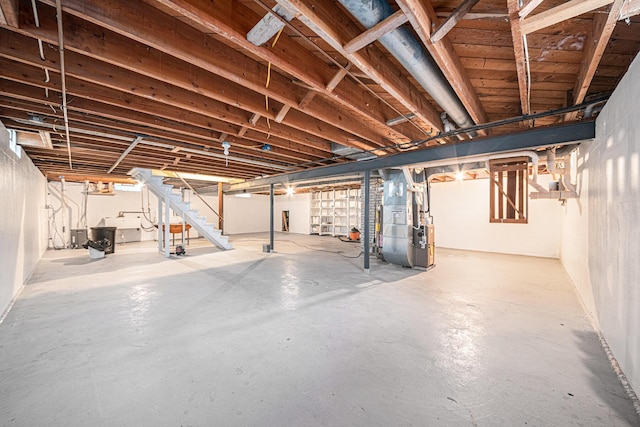 7432 Burlingame Ave SW, Byron Center, MI 49315 - unfinished below grade area featuring heating unit and stairway